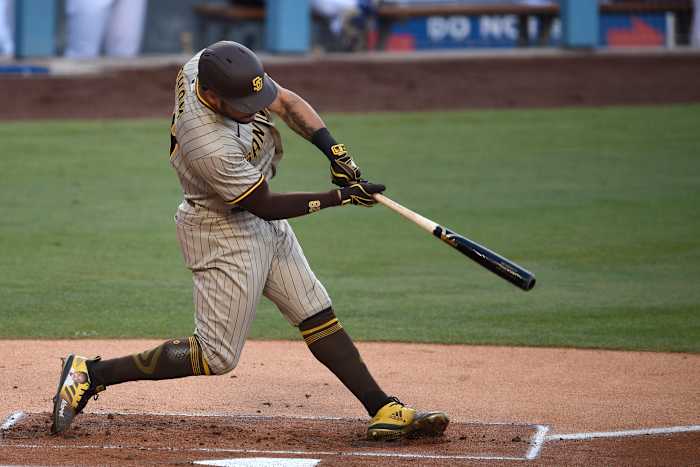 San Diego Padres left fielder Tommy Pham (28) hits a solo home run during the first inning against the Los Angeles Dodgers at Dodger Stadium. Credit: Kelvin Kuo-USA TODAY Sports